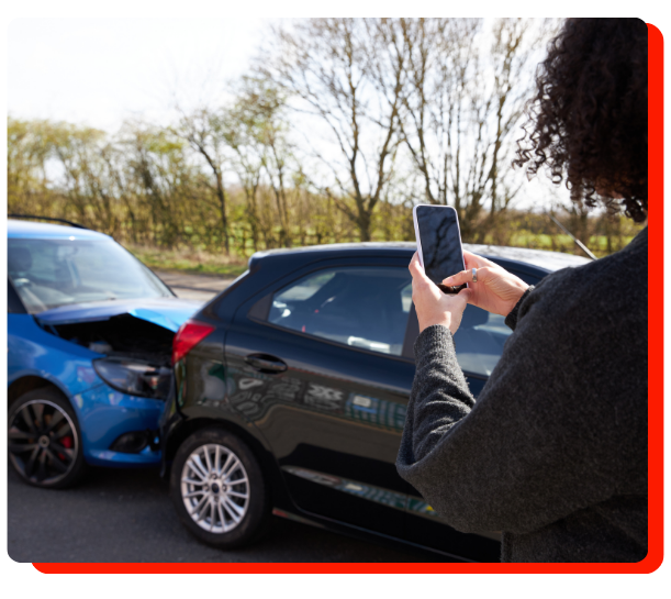 "Driver taking photos of accident damage before collision repair in Etobicoke"